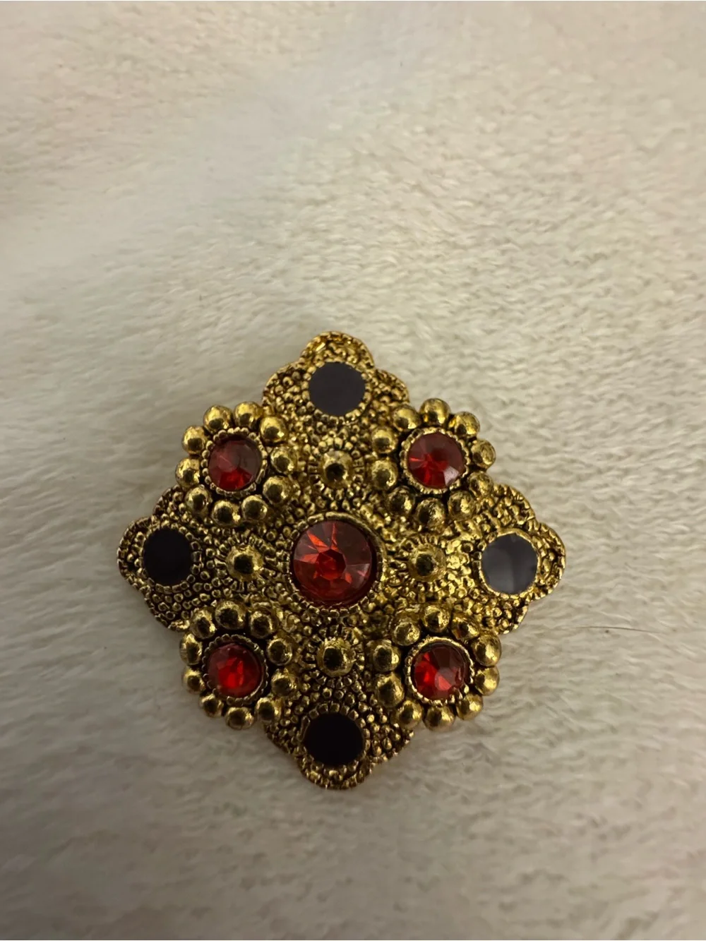 Gold-Tone Brooch with Red Crystal Accents
